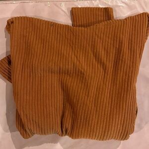 I am selling a kids cat and jack sweater. It is orange. ‘Size  XL (14/16).